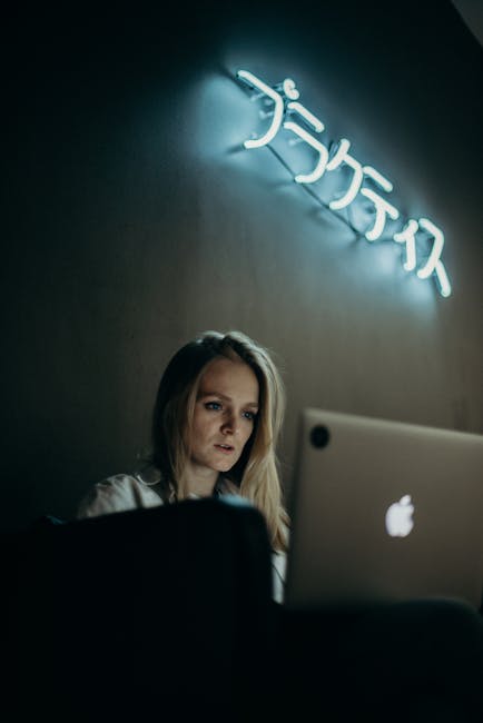 tired person looking at computer screen with strained eyes in modern office environment showing digital eye strain